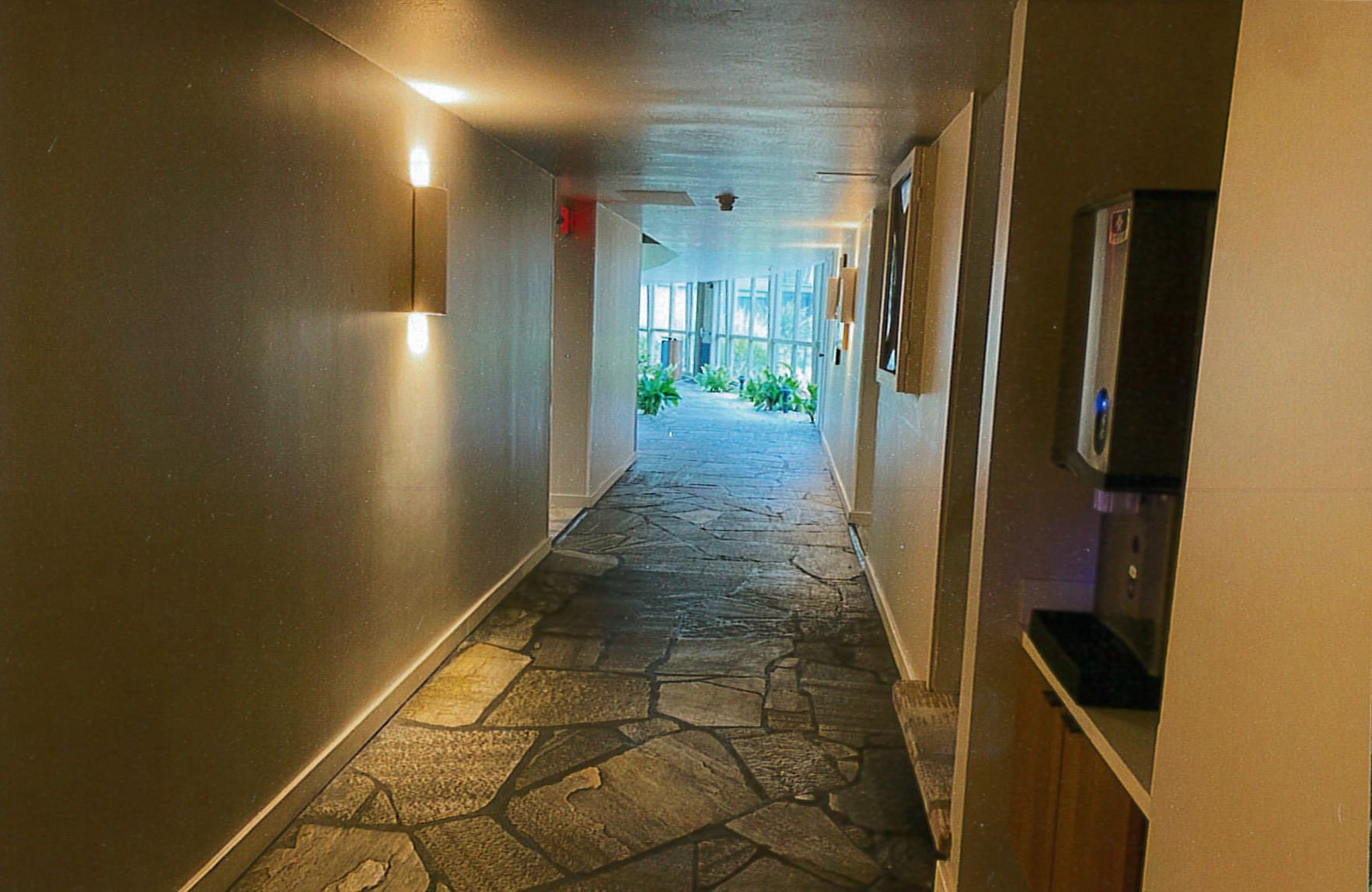 First floor corridor, restored flagstone, updated light fixtures